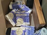 many rolls of toilet paper sitting in a cardboard box