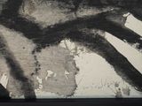 a black and white picture of a painting on a wall