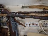 many different types of weapons on display in this room