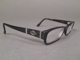a pair of glasses sitting on a table next to each other