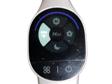 a smart watch that is sitting on top of a table