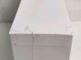 a close up of a white box on a table