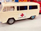 a toy van with a red cross sign on top of it