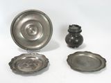 three pieces of silverware are sitting on a white surface