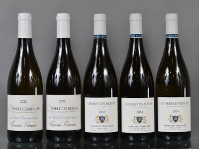 six bottles of wine are lined up in a row on a table