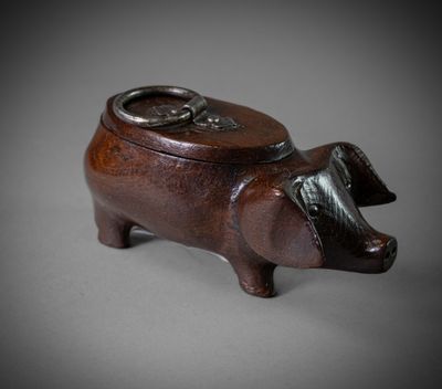 an image of a wooden pig with a ring on it ' s nose
