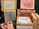 several boxes of various items are stacked on top of each other
