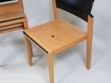 a small chair and a small chair that are next to each other