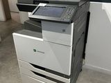 a multi - function printer sitting on the floor in a room