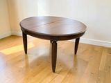 a wooden table with a wooden top on a hard wood floor