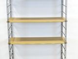 a wooden and metal shelf with four shelves on each side