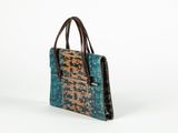 an image of a blue and brown handbag on a white background