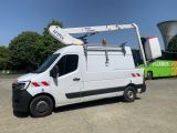 a white van parked in a parking lot with a green bus in the background