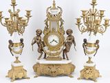 a lot of different types of clocks on the table