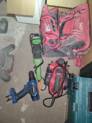a lot of tools that are laying out on the floor