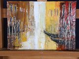 a painting that is on a easel in a room