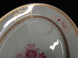 a close up of a plate with a floral design on it