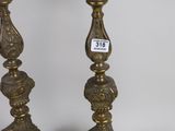 pair of antique brass candlesticks with ornate designs
