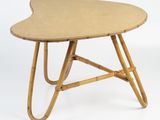 a close up of a wooden table with a heart shaped top