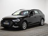 the audi audi wagon is parked in a room with checkered flooring