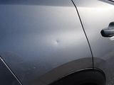 a close up of a car ' s door handle and door handle