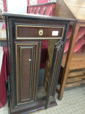 a wooden cabinet with a door on the top of it