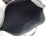 a black and white purse with a silver handle