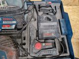 a blue box with tools in it sitting on a table