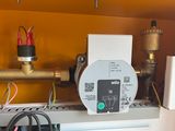 a picture of a water meter on a shelf in a room