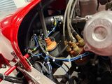 a close up of the engine of a red race car