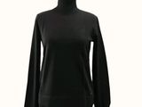 a woman ' s black sweater on a mannequin mannequin