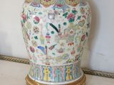 a vase with a lid sitting on a table