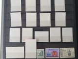 a lot of stamps on a black folder