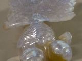 a plastic fish that is sitting on a table