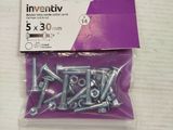 an assortment of screws and nuts in a bag on a table