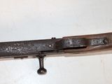a close up of a metal object on a white surface