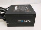 a black box with a power cord attached to it