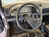 a steering wheel and dashboard of a car in a garage