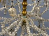 a close up of a chandelier with glass beads hanging from it