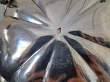 a silver pumpkin sitting on top of a table