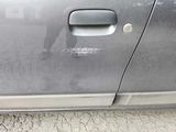 a close up of a car door handle with a sticker on it