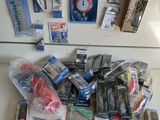 many different types of fishing lures on the counter