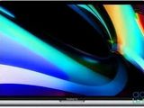 an apple macbook pro is shown with a colorful background