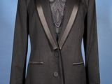 an image of a black tuxedo suit on a mannequin stand