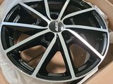a black and white rim in a box on a table