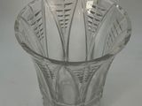 a glass bowl with a pattern on it on a table