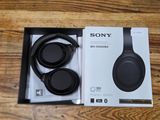 the sony headphones are in the box on the table