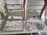 a table with a mirror and jewelry on it