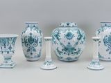 four vases that are sitting next to each other on a table