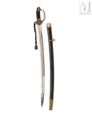 an old sword with a wooden handle and brass fittings